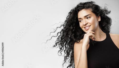 Картината върху платно young woman with curly black hair