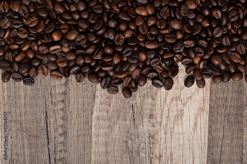 coffee beans on an old wooden background