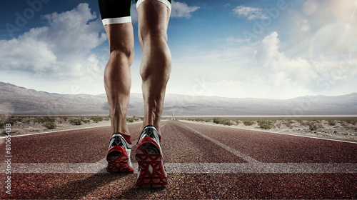Sports background. Runner feet running on road closeup on shoe