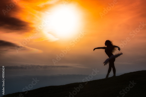 Ballerina silhouette, dancing alone in nature in the mountains a © michelangeloop