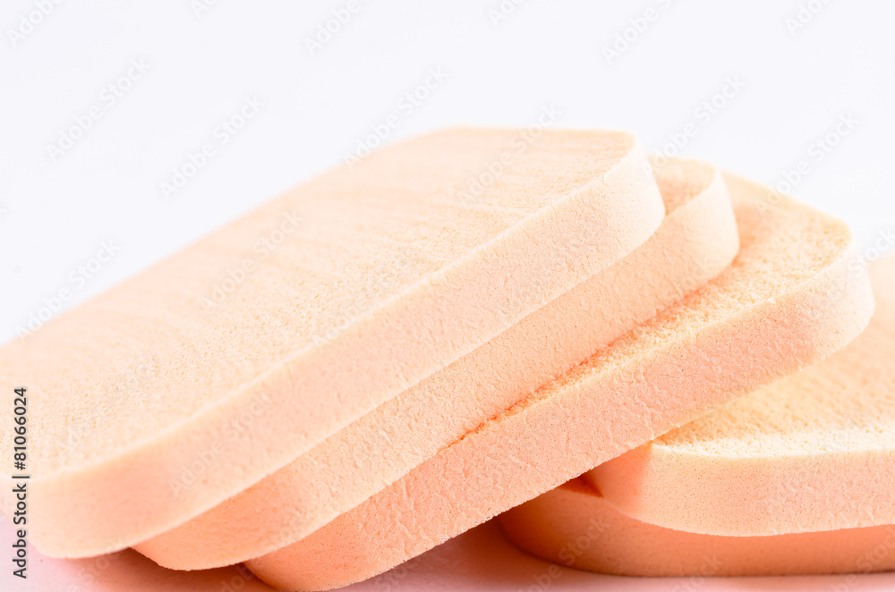 stack of face powder sponge on white background stack of face powder sponge on white background