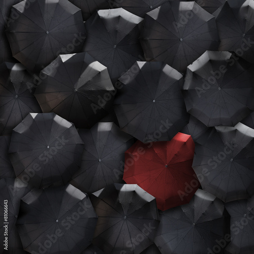 Top view umbrellas society background. Red in mass of black. Sta