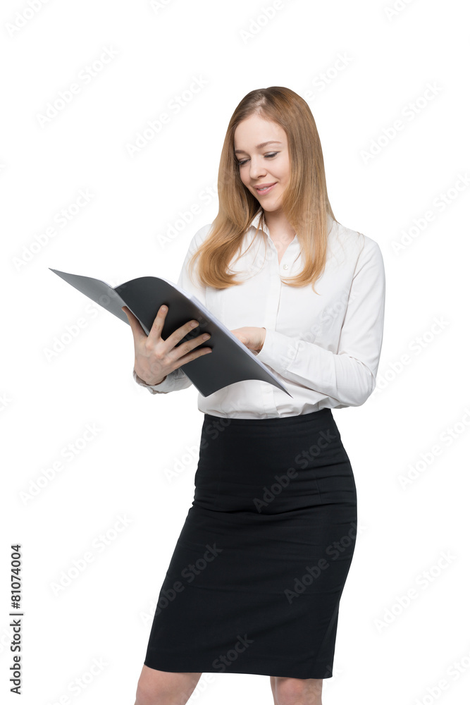 Young business lady is looking at the file. Isolated. Young business lady is looking at the file. Isolated.
