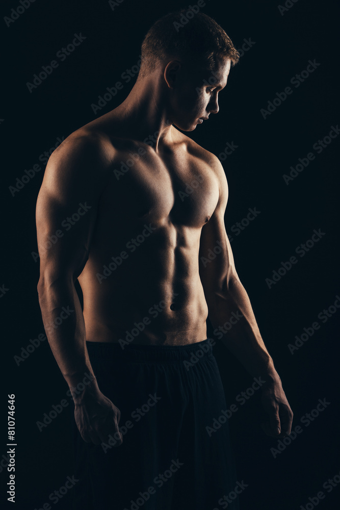Close up of sports man's muscular isolated on black background Close up of sports man's muscular isolated on black background