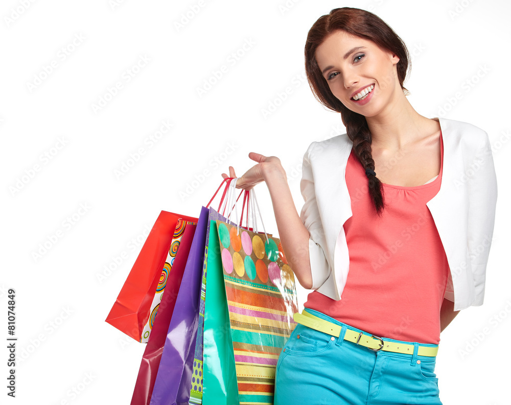 Shopping woman holding bags, isolated on white studio background Shopping woman holding bags, isolated on white studio background