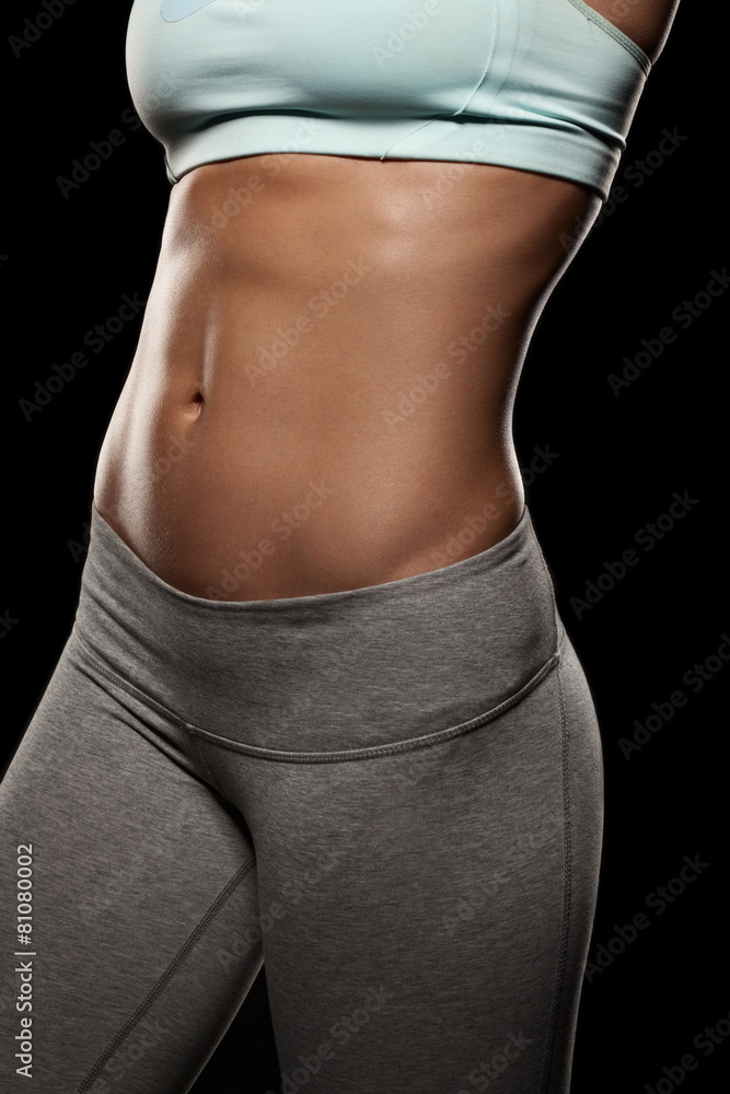 Fototapeta premium Fitness female woman with muscular body, do her workout, abs