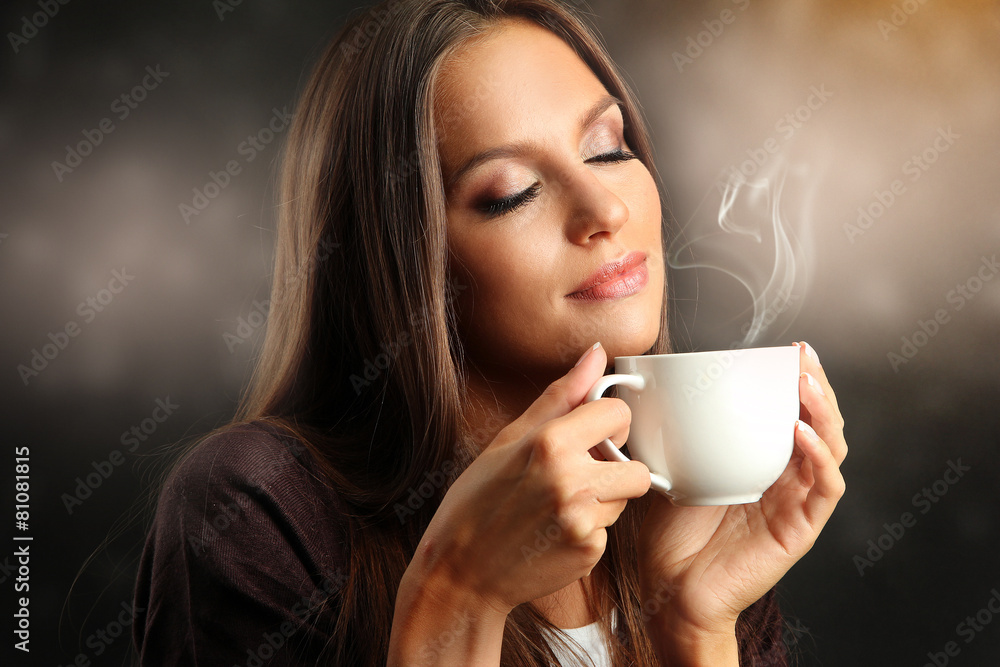 Beautiful young woman with cup of coffee Beautiful young woman with cup of coffee