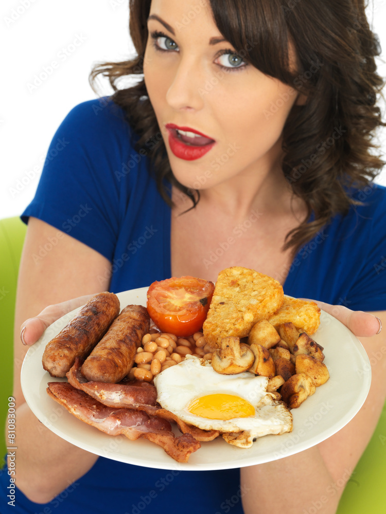 Young Woman Eating a Full English Breakfast Young Woman Eating a Full English Breakfast