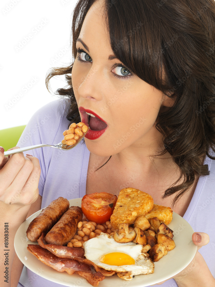 Young Woman Eating a Full English Breakfast Young Woman Eating a Full English Breakfast