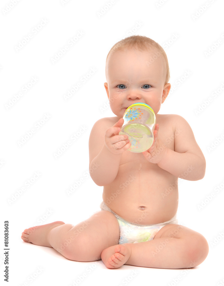 Infant child baby toddler sitting and drinking water from the fe Infant child baby toddler sitting and drinking water from the fe