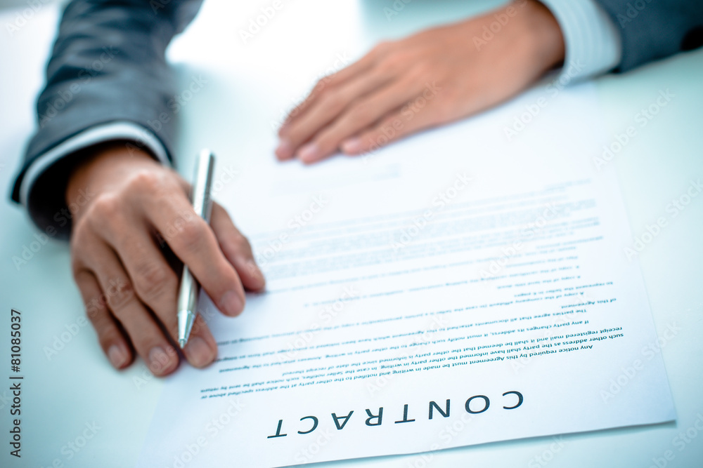 Business man signing a contract Business man signing a contract