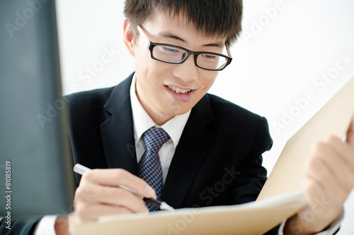 Businessman analyzing investment charts. Accounting