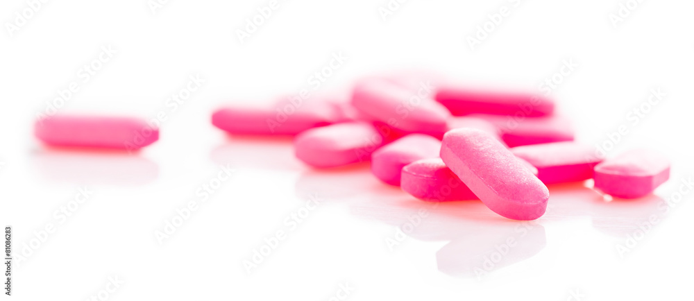 Group of pink medical pills isolated