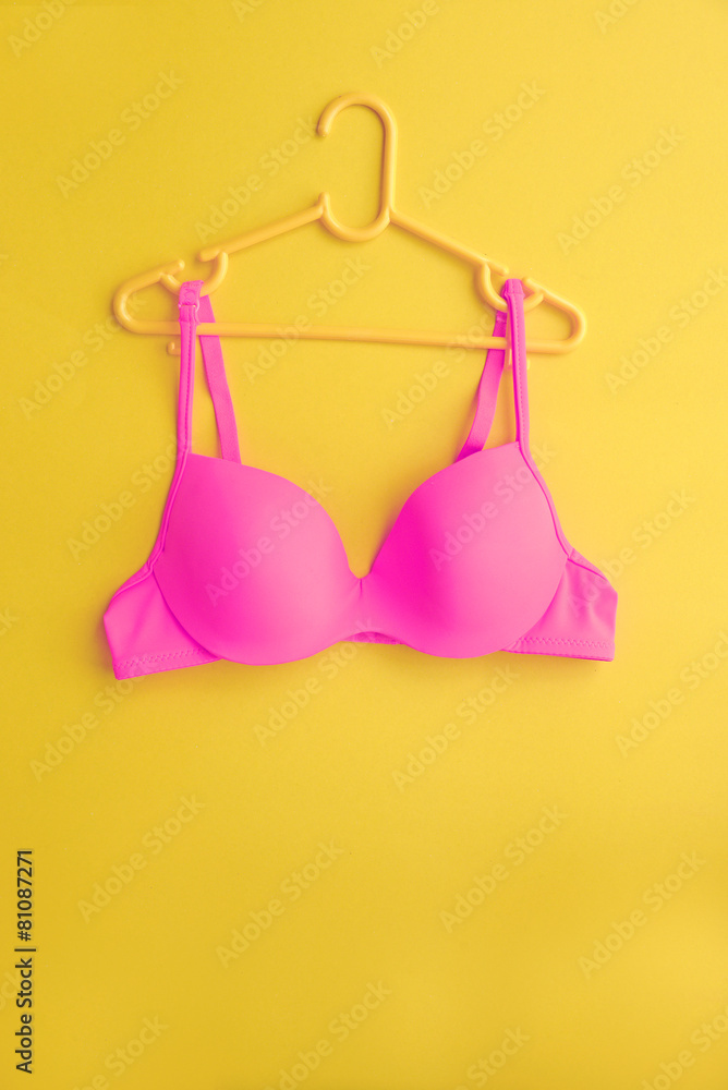 Summer concept, bra on coat hanger on blue. (Pop art style)