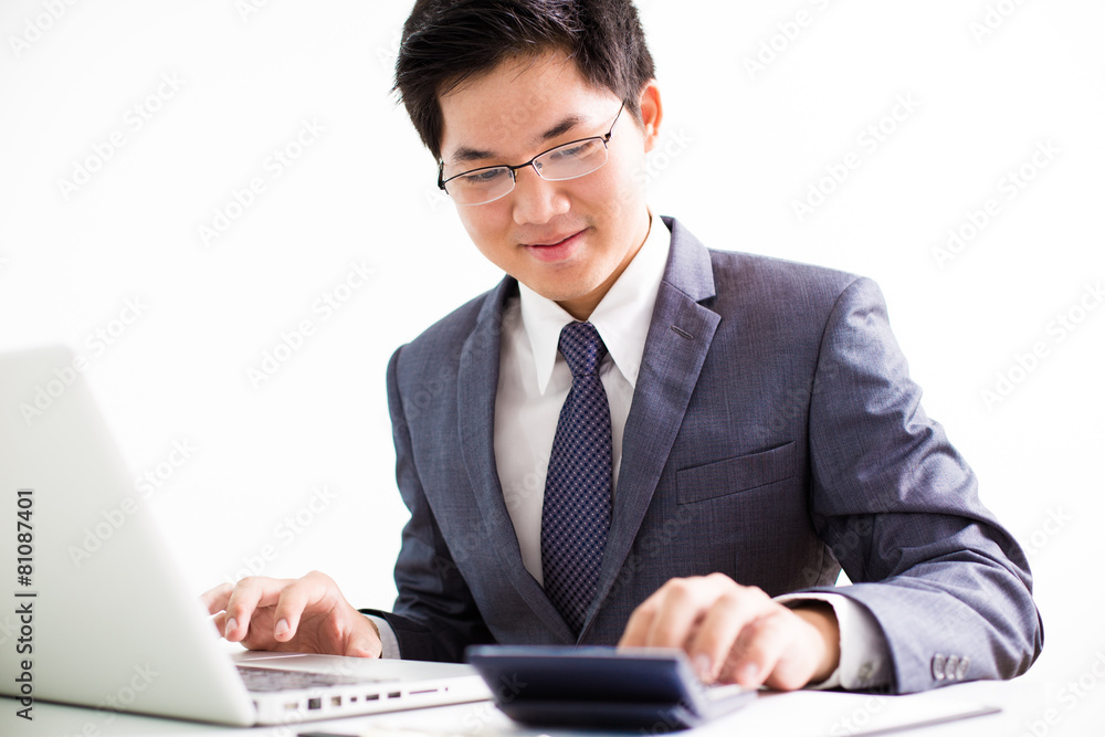 Handsome businessman working with laptop Handsome businessman working with laptop