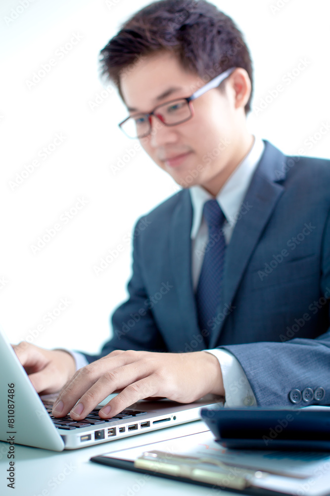 Handsome businessman working with laptop Handsome businessman working with laptop