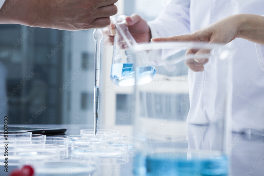 Researchers are using a dropper for the experiment Researchers are using a dropper for the experiment