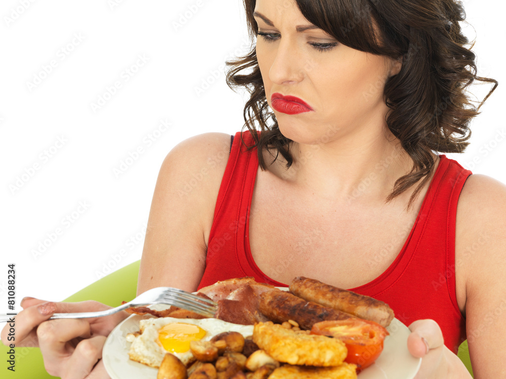 Young Woman Eating a Full English Breakfast Young Woman Eating a Full English Breakfast