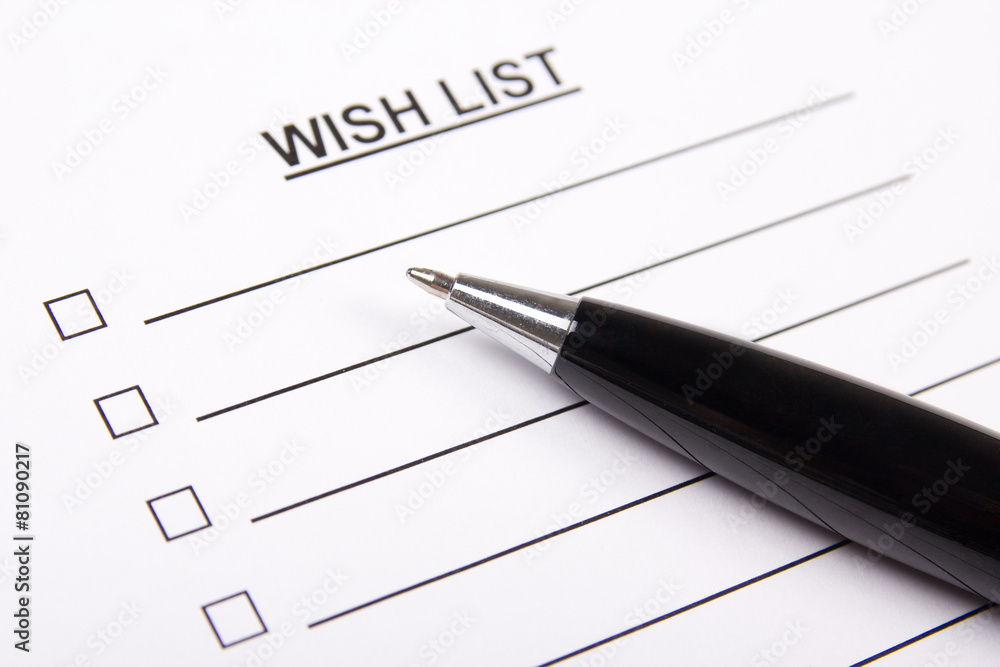 white paper with blank wish list and pen white paper with blank wish list and pen