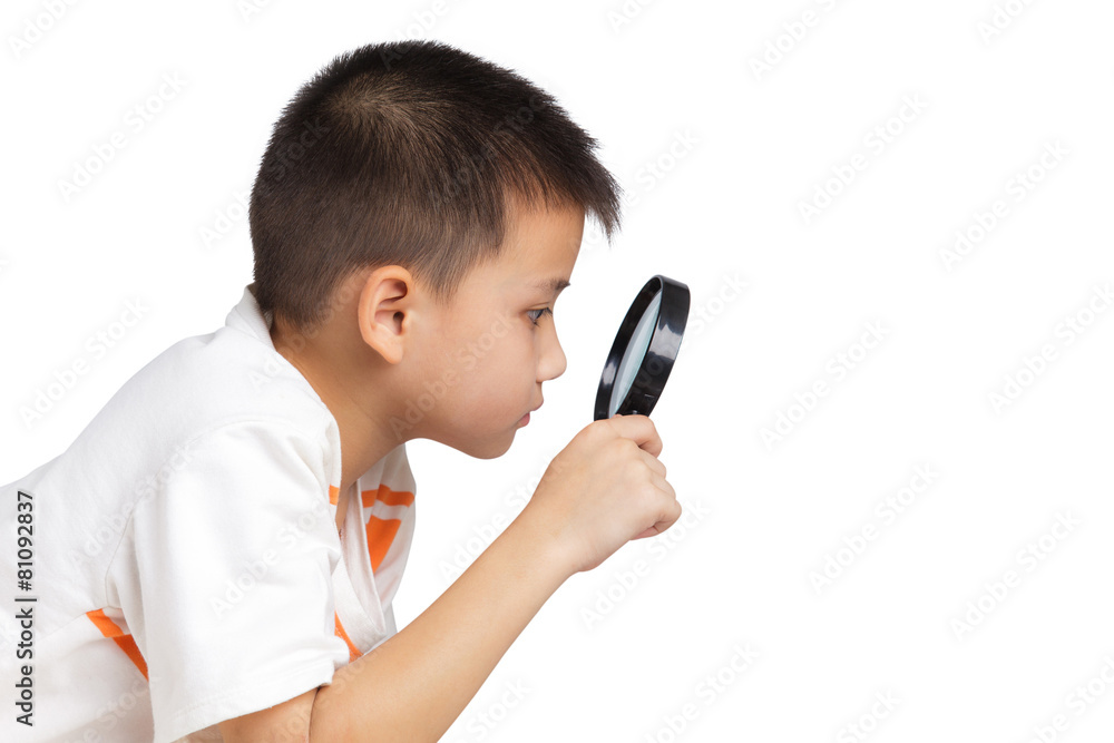 Boy holding a magnifying glass