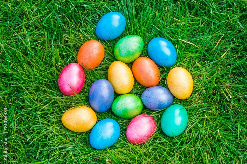 Colorful Easter eggs on a green grass