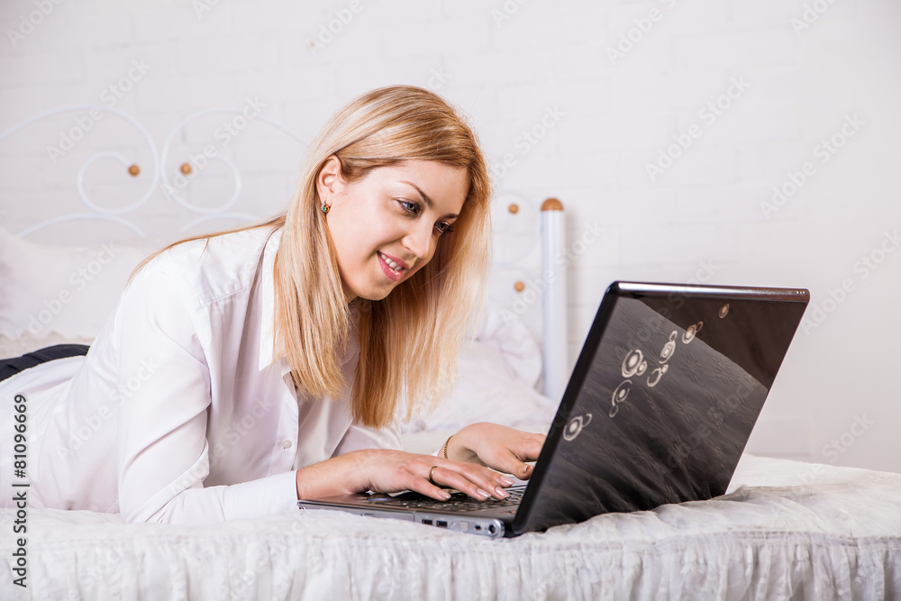 Woman using laptop at home Woman using laptop at home