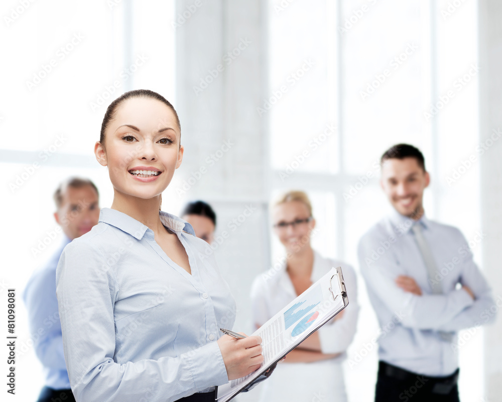 young smiling businesswoman with clipboard and pen young smiling businesswoman with clipboard and pen