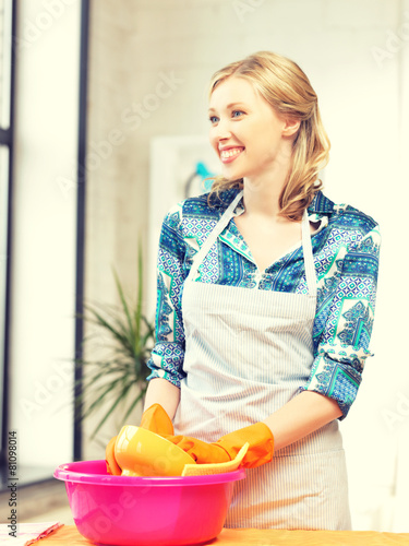 housewife washing dish at the kitchen