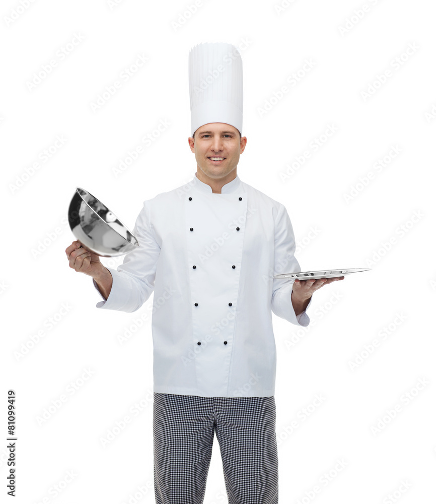 happy male chef cook opening cloche