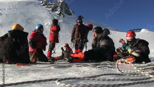 Climber resting on a glacier before climbing to the top of the mountain. Altai, in November 2015, the foot of the mountain Aktru, altitude 4000