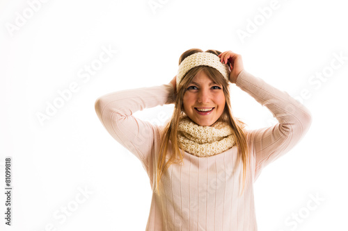 Girl in a sweater  smiling on a white background photo