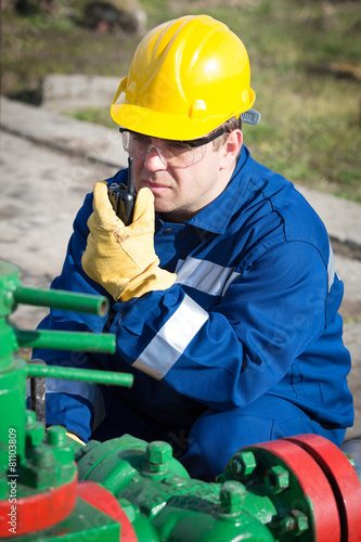 Worker on the oil field. Refinery, oil and gas