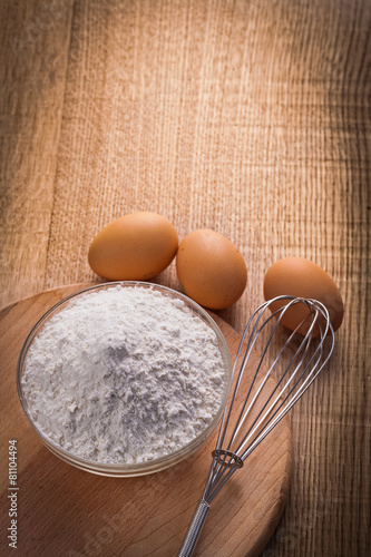 vertical view flour in bowl corolla eggs on wooden board food an