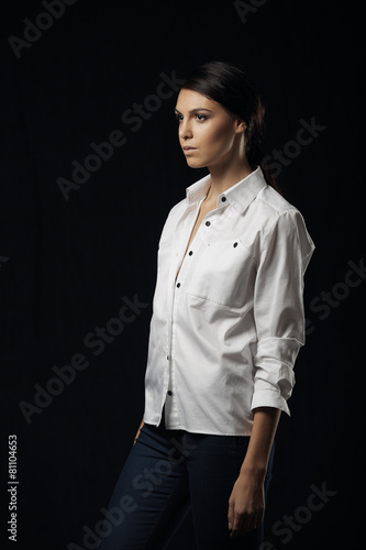 Fashion photo of young magnificent woman in white shirt