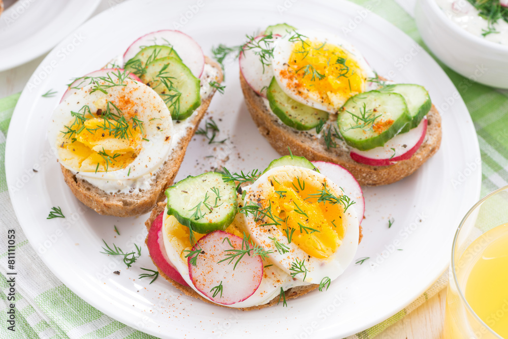 buns with boiled egg and vegetables, top view, close-up buns with boiled egg and vegetables, top view, close-up
