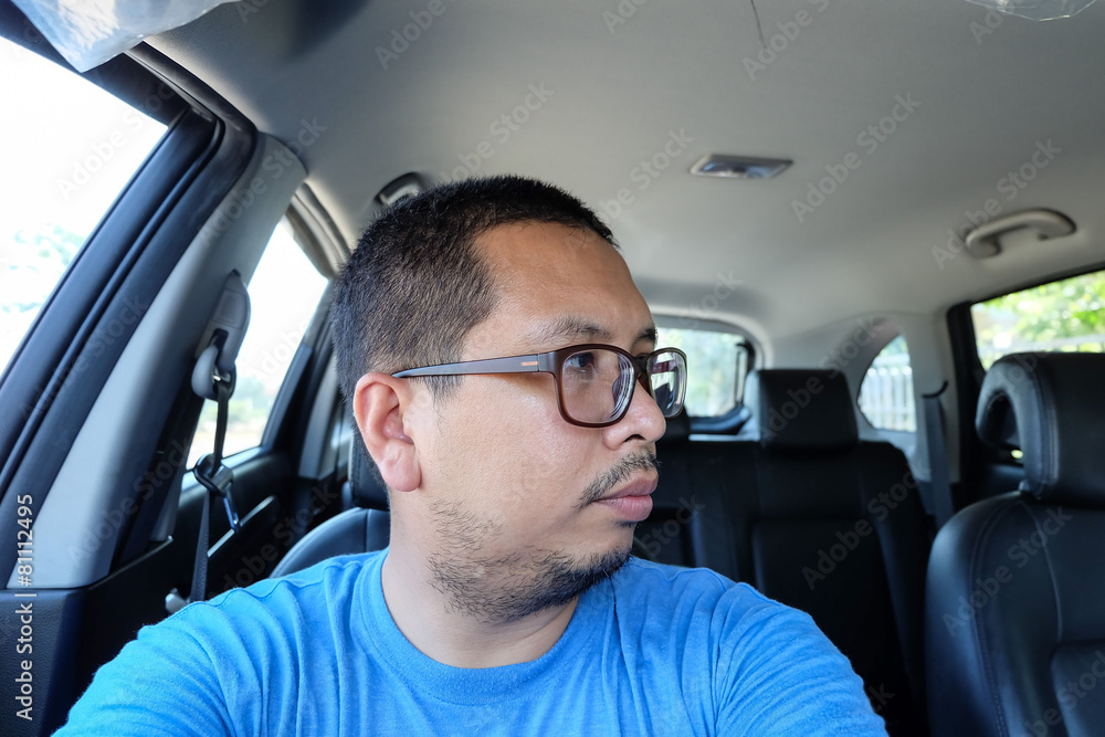 man look right and driving a car without seat belts man look right and driving a car without seat belts