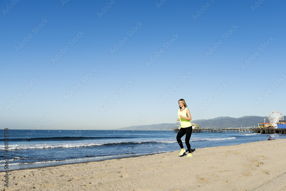 A lady running on the beach