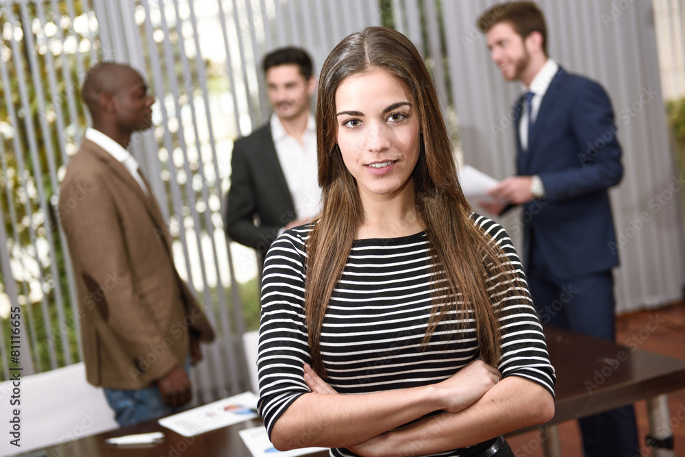 Businesswoman leader looking at camera in working environment. Businesswoman leader looking at camera in working environment.
