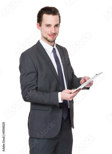 Casual Businessman Looking at a tablet