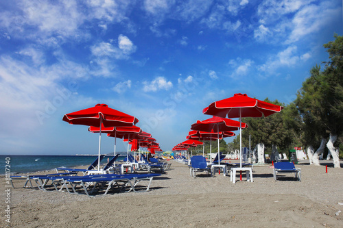 red umbrellas on the beach. Greece, Rhodes