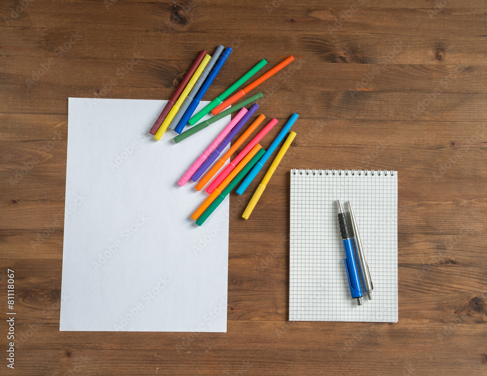 Obraz premium multicolor markers, paper sheet and notebook