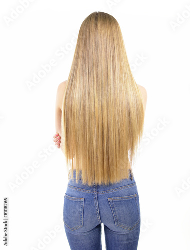 Hair. Beautiful woman with long healthy shiny smooth hair. Back