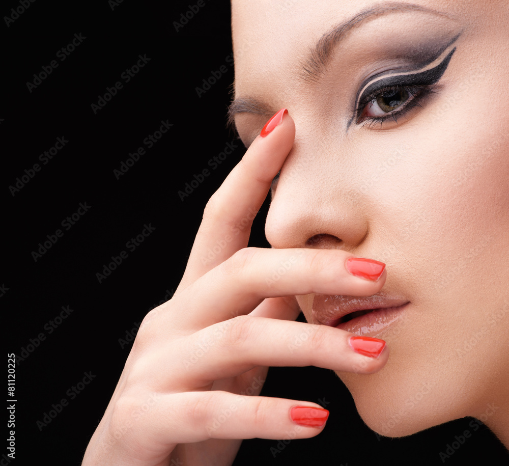 Woman with glamour make up arrow and nail art Woman with glamour make up arrow and nail art