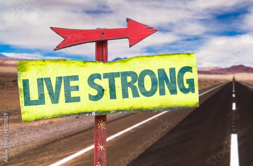 Live Strong sign with road background photo