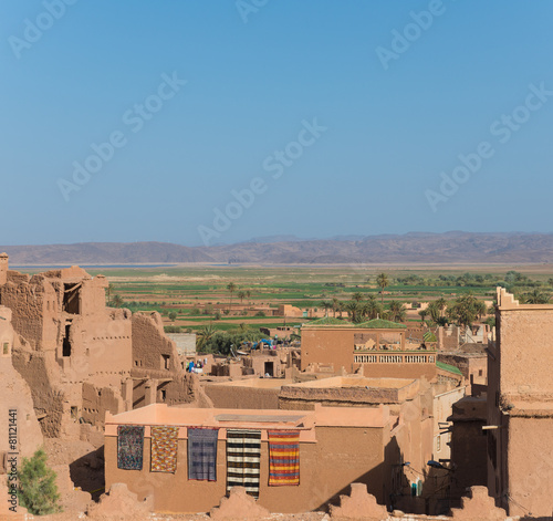 The traditional house in Arabian style with blue sky and green f photo