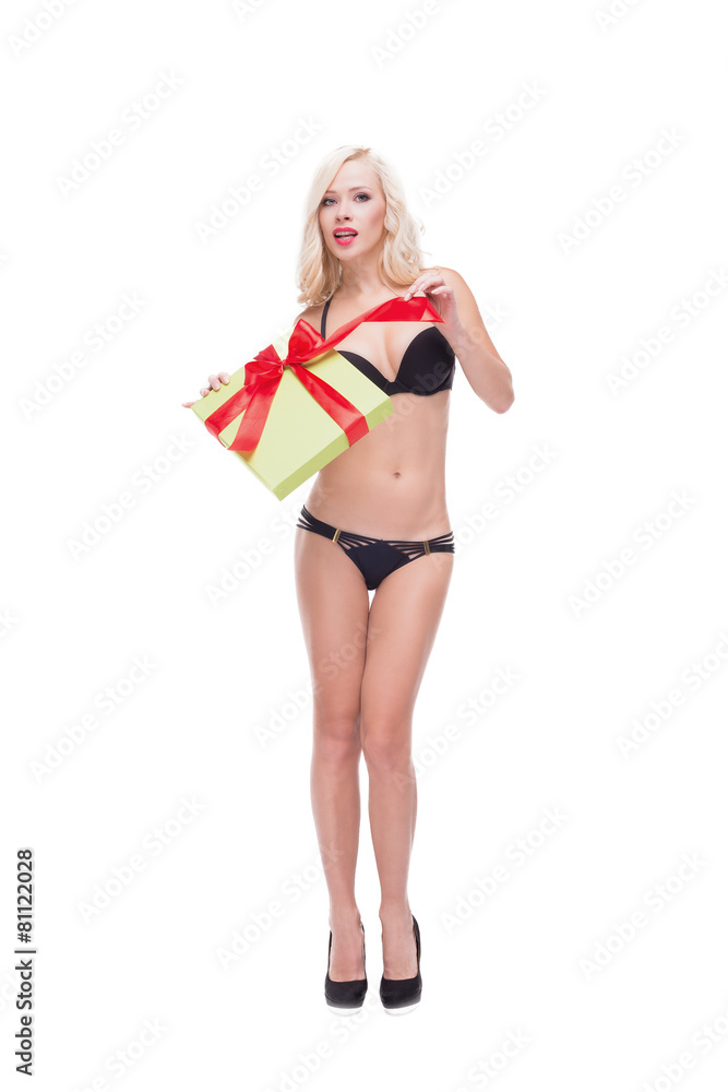 Blonde woman wearing swimsuit holding present Blonde woman wearing swimsuit holding present