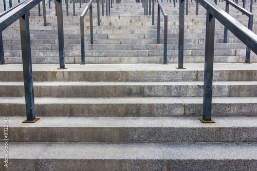 Stone steps with black metal railing