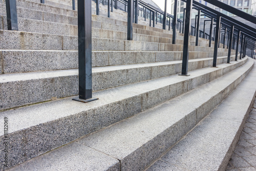 Stone steps with black metal railing