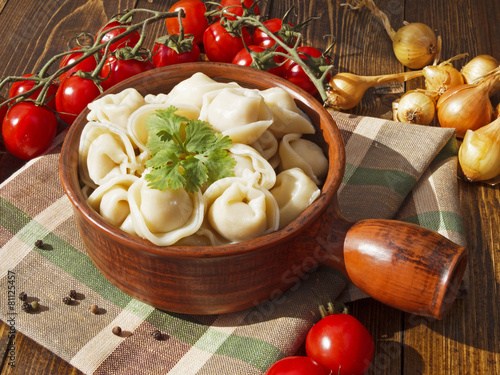 dumplings with meat on a wooden table