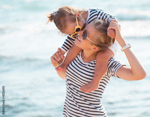 Mother with daughter on the beach